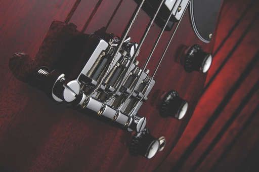 The newer combo type bridge offers greater string adjustment