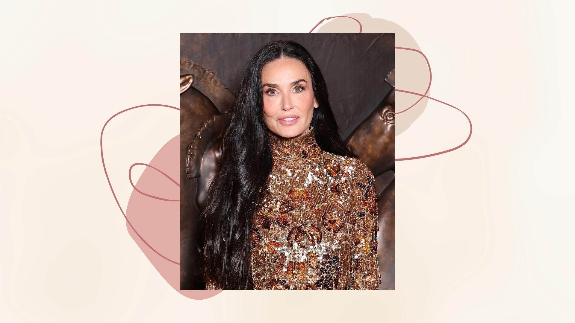 Image of Demi Moore with long wavy black hair over one shoulder and wearing a gold sequin high-neck gown, on a neutral background with beige and mauve graphics