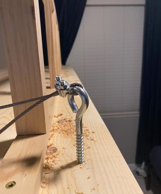 eyelet screw in a DIY loft bed strung with airline cable - Brooke Waite