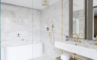 White marble bathroom with gold features
