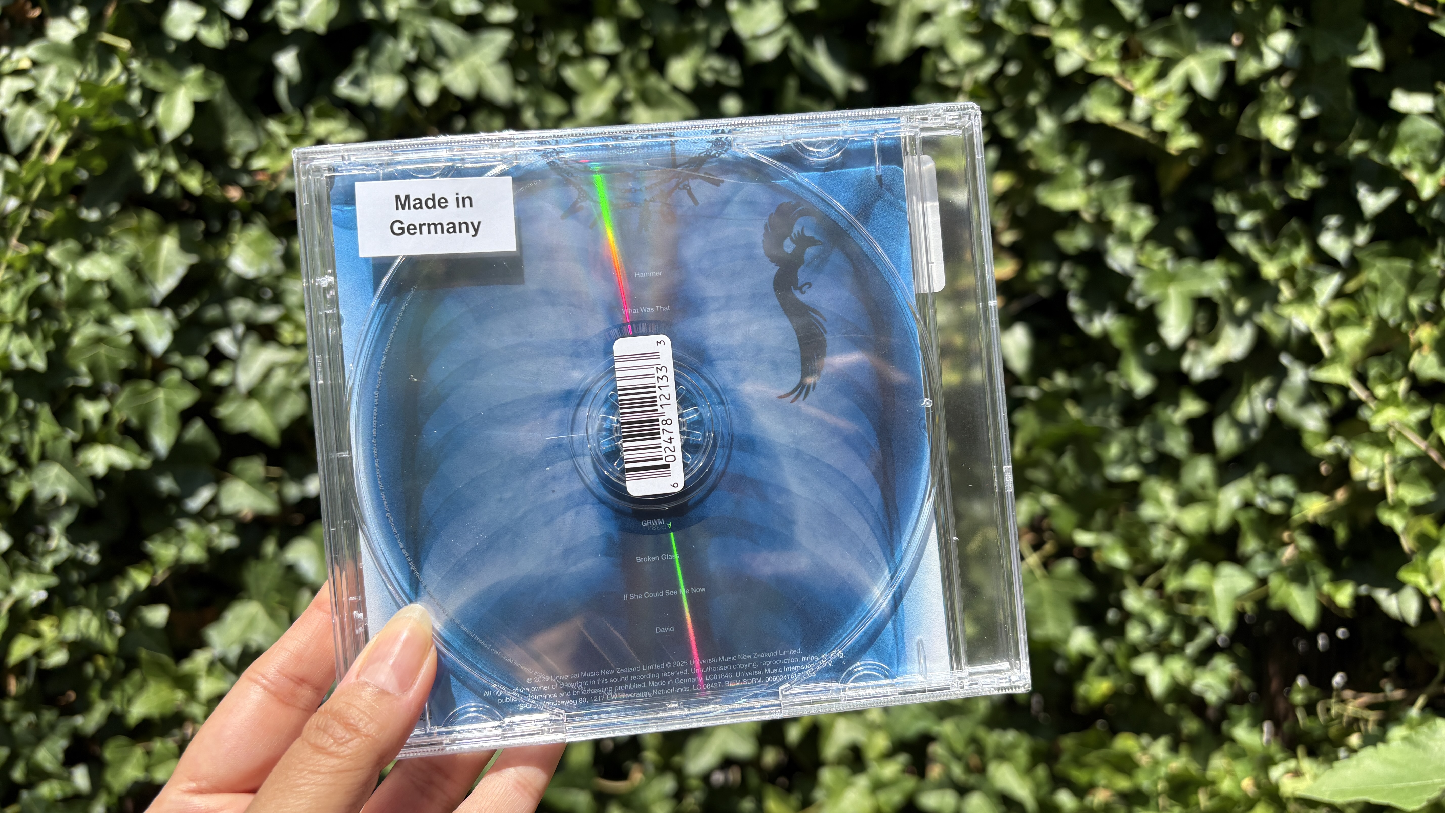 Lorde transparent CD held in hand
