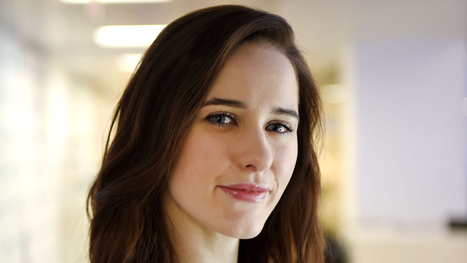 Rachel Brosnahan on a neutral background