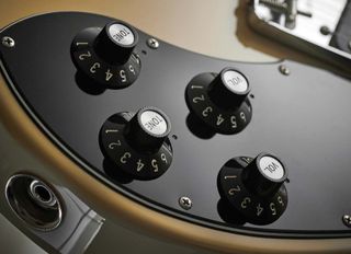 The old-school Gibson-style controls layout is retained.