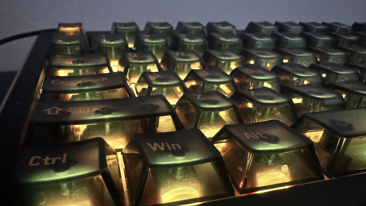 Melgeek Real 81 gaming keyboard on a desk, from the front, showing off its RGB lighting