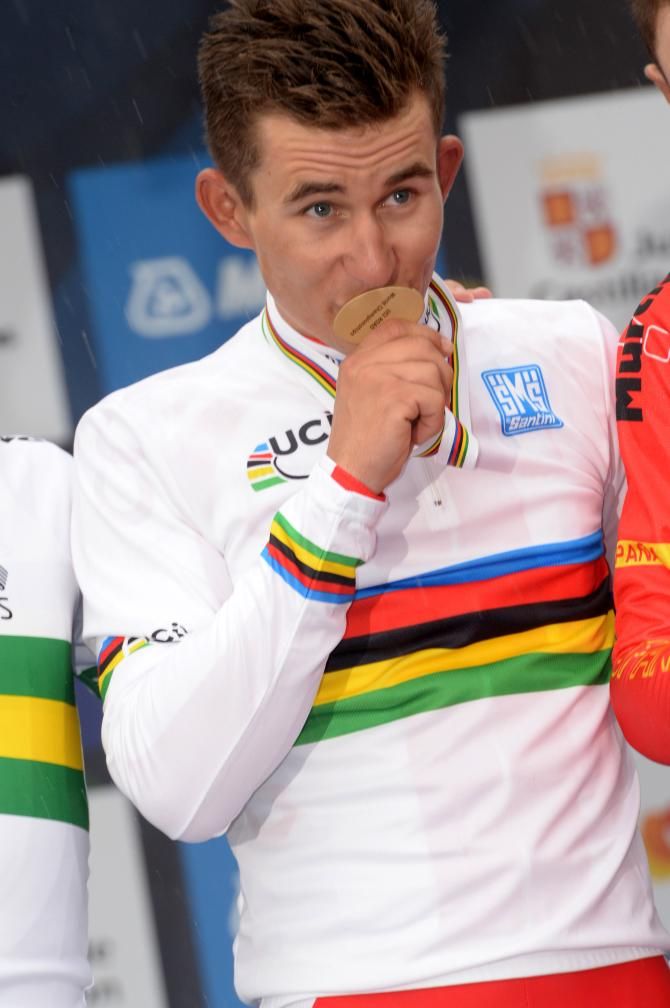 Michal Kwiatkowski (Poland) kisses his gold medal