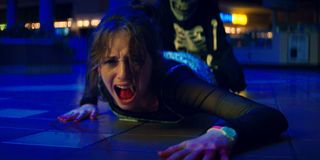 Maya Hawke screams as she's dragged by Skullmask in Fear Street Part 1 - 1994.