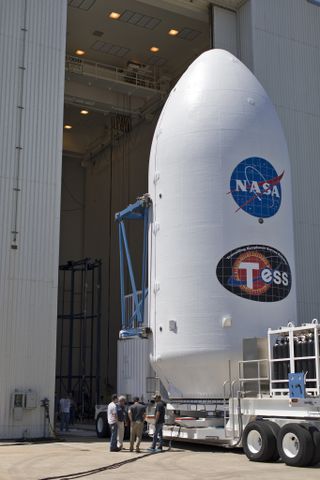 The payload fairing for NASA's TESS satellite heads into the Payload Hazardous Servicing Facility at Kennedy Space Center in Florida.