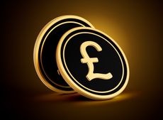 Two Golden And Black Rounded British Pound