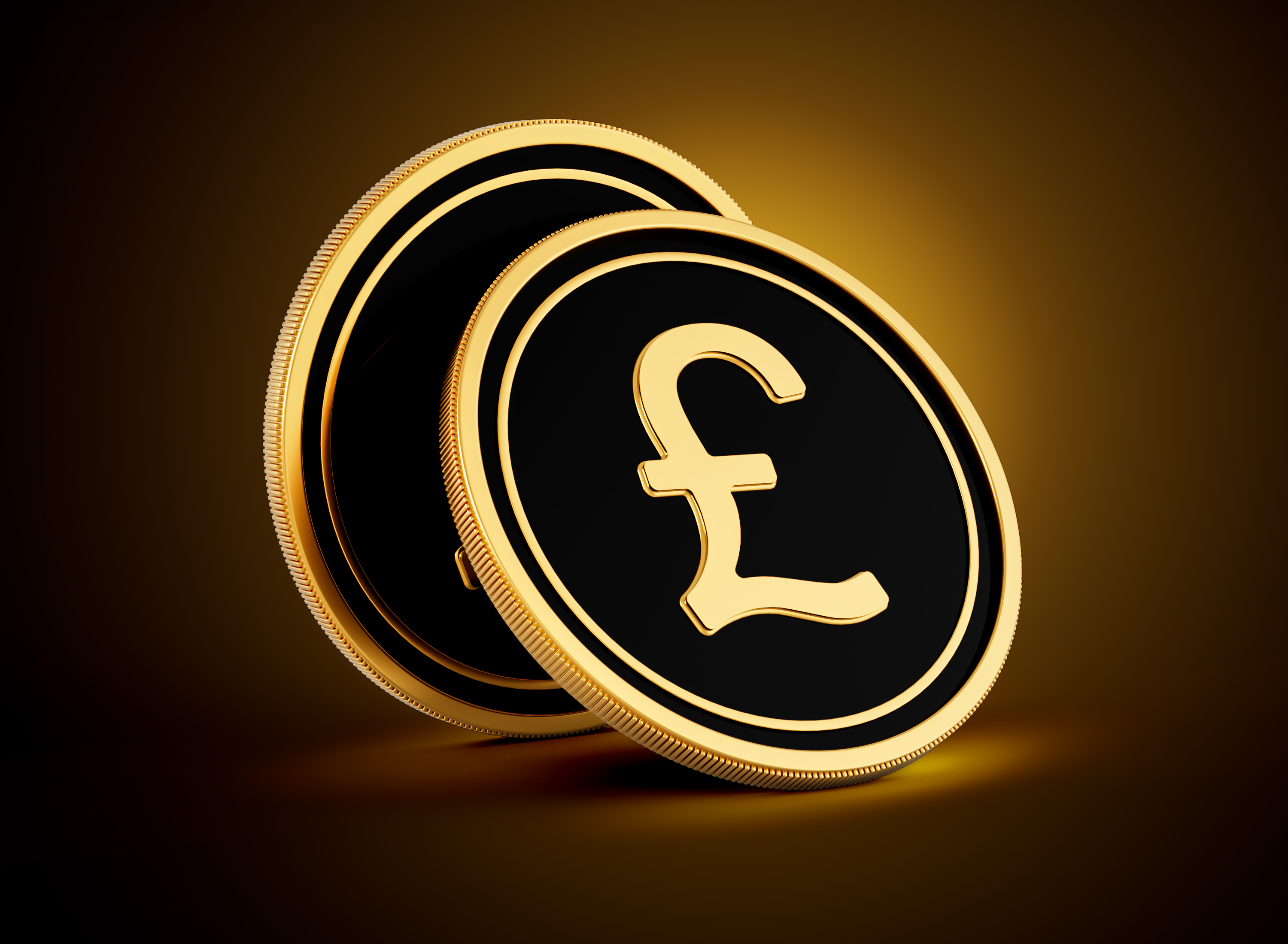 Two Golden And Black Rounded British Pound