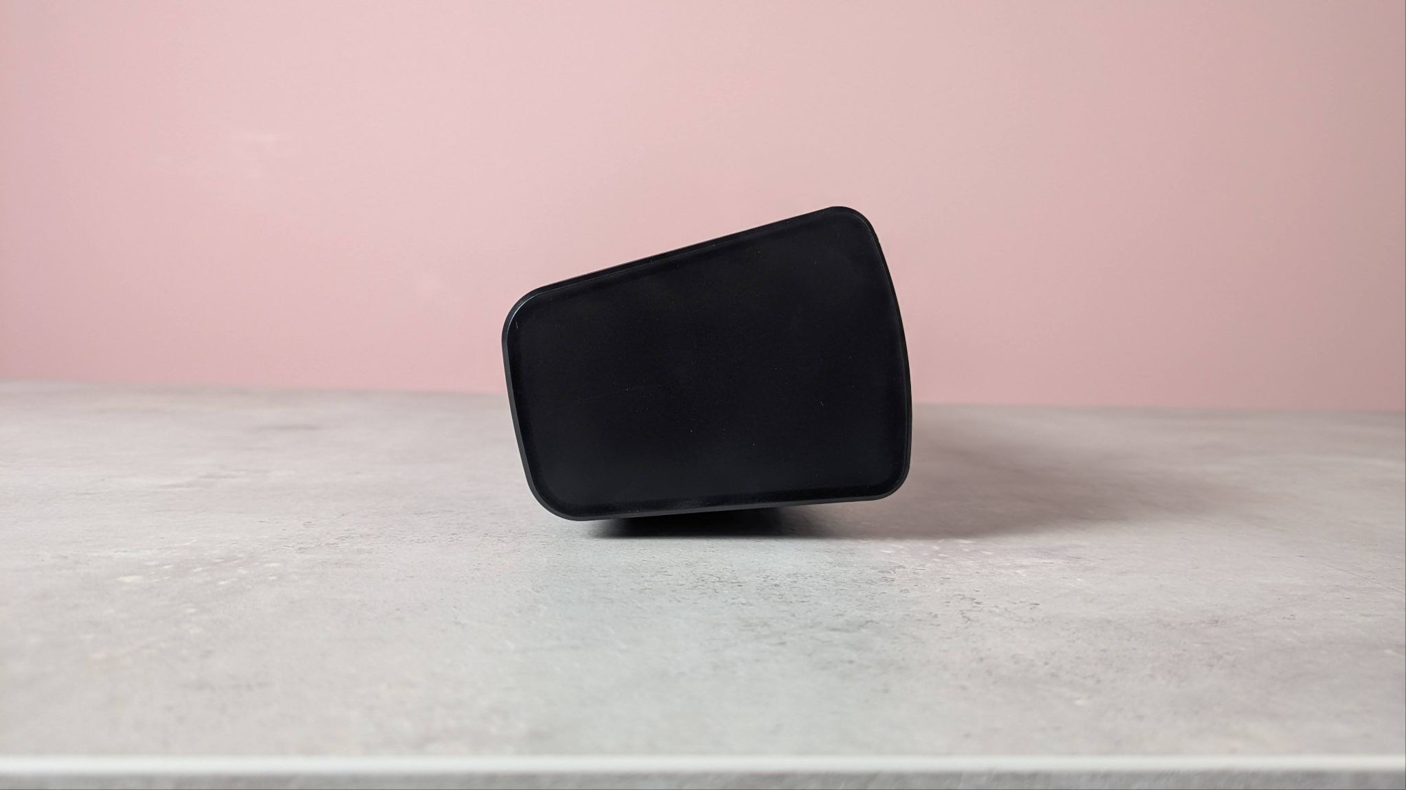 Creative Sound Blaster GS5 on a desk with pink wall in background