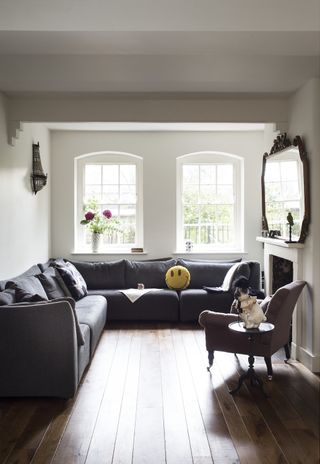 white living room with grey corner sofa
