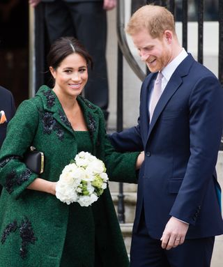 Prince Harry and Meghan Markle attend an engagement in green