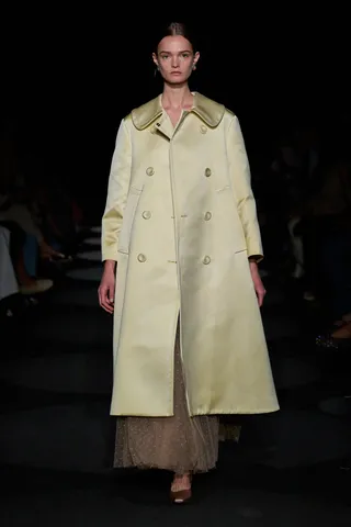 Altuzarra spring/summer 2024 a model in yellow coat