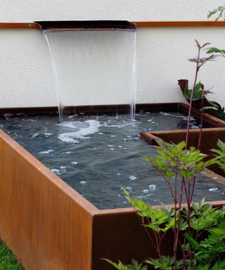 small pond with wall water feature