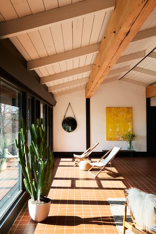 Modern sunroom with terracotta flooring