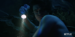 stranger things season 4 teaser screenshot steve underwater flashlight