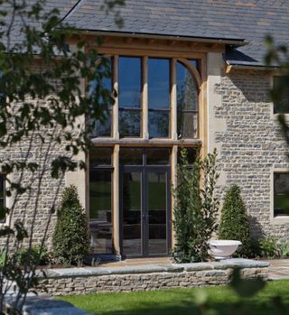 Bronze casement windows on the exterior of a home