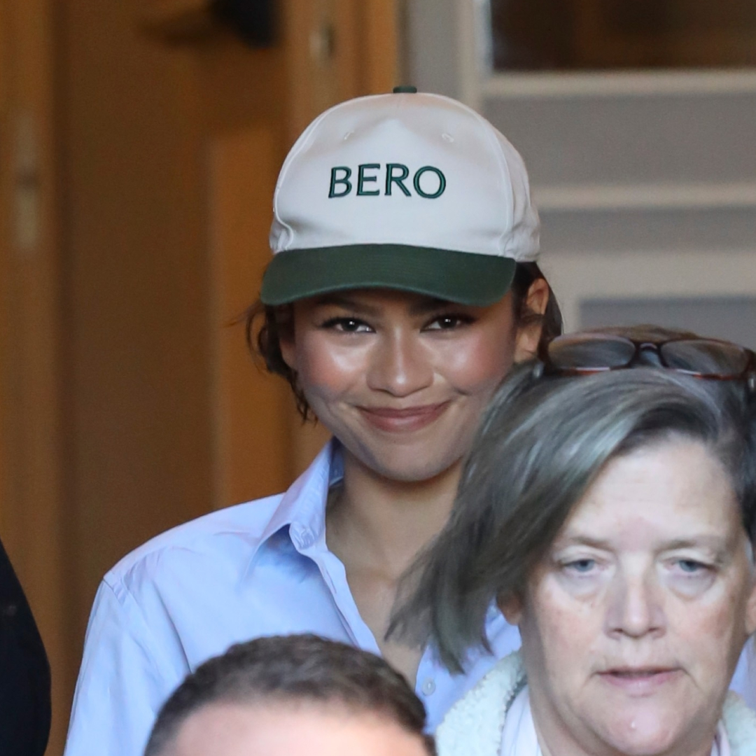 Zendaya wearing a Bero cap, referencing rumored husband Tom Holland's brand during a shopping trip in Rome, Italy, paired with cuffed jeans, a shirt, and The Row loafers