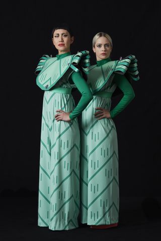 two women wearing theatre costumes