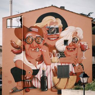 Three cartoon figures painted on a two-storey house
