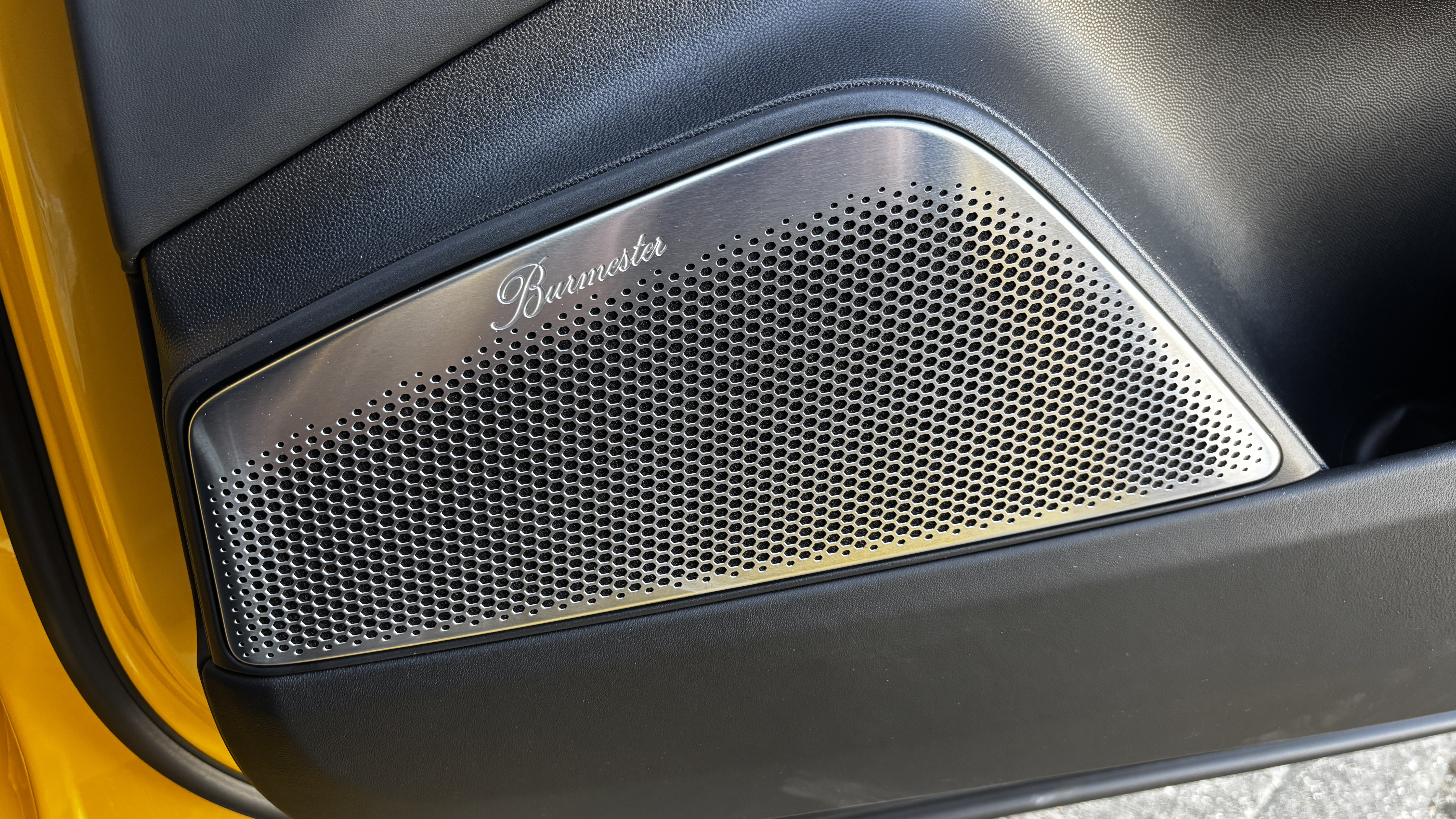 A Burmester speaker grille in the Porsche Macan Electric