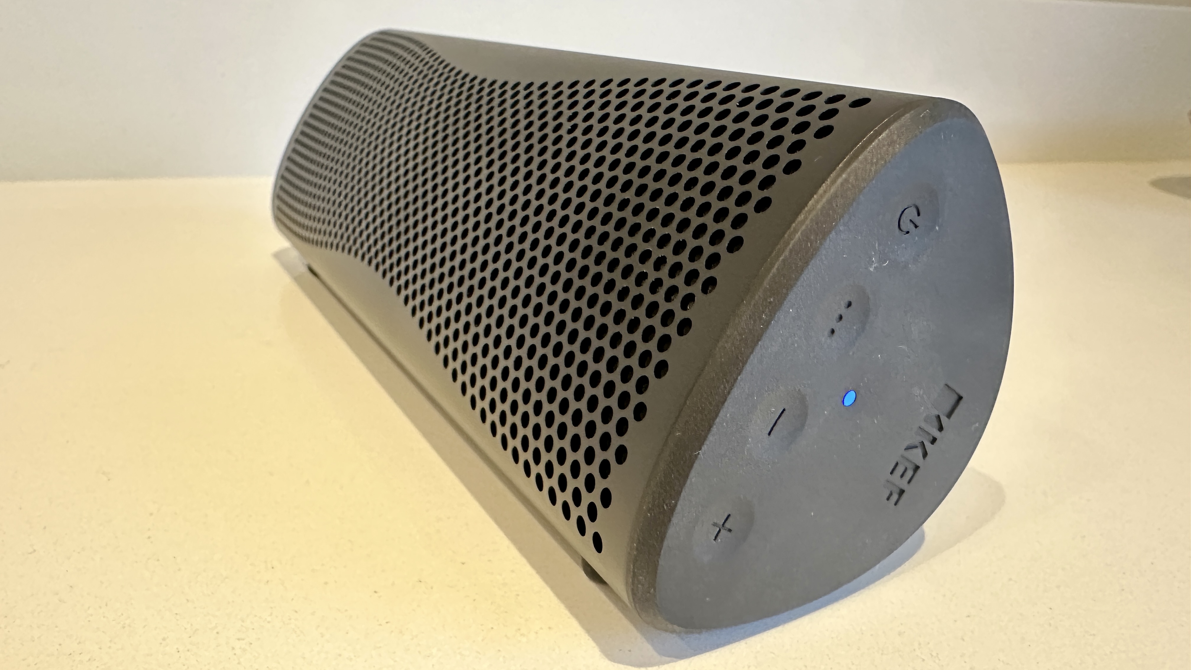 KEF Muo 2025 in black, on a white table