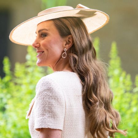Princess Kate wearing a boater hat and cream dress