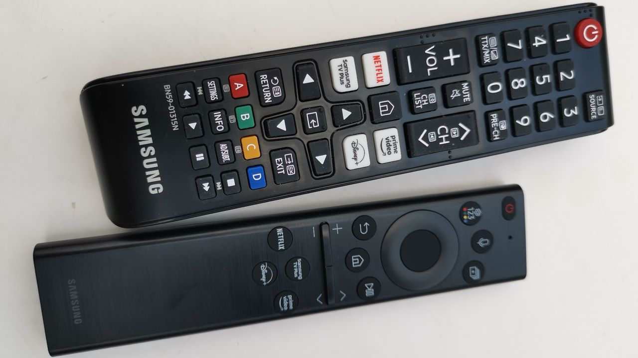 Samsung S95B TV remotes sitting on white surface