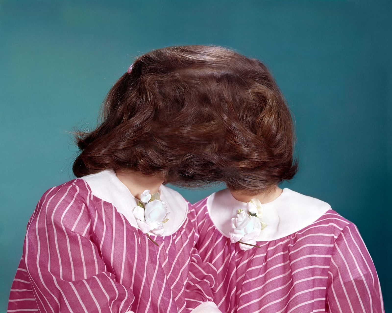 photo of twins, hidden by hair