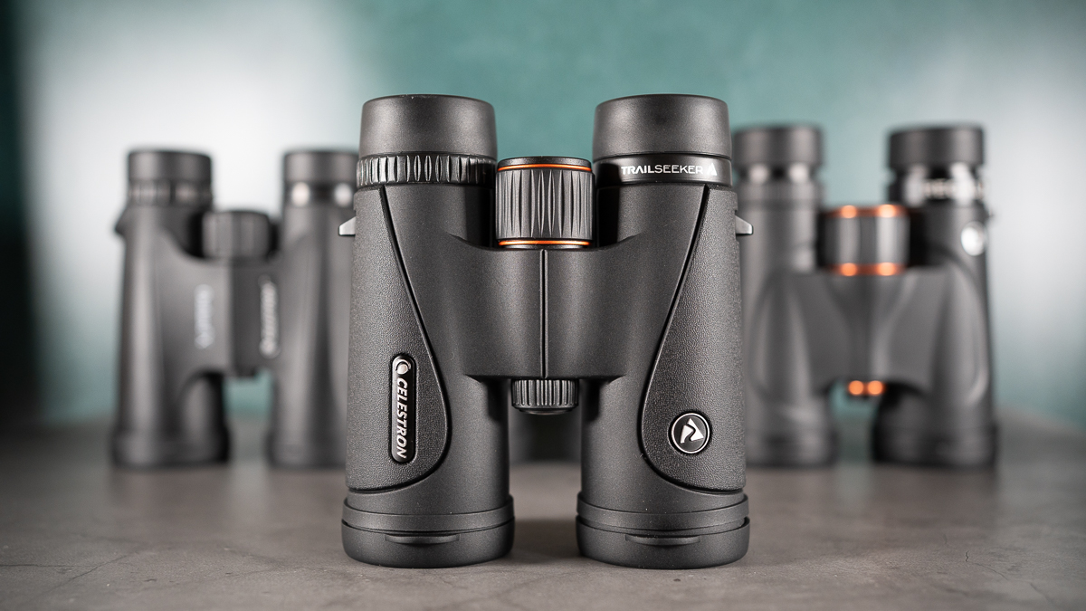 Celestron TrailSeeker 10x42 binoculars against a dark background