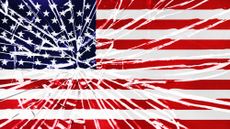 Flag of United States behind shattered glass with radiating cracks