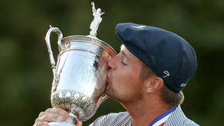 Bryson DeChambeau of the United States kisses the championship trophy in celebration after winning the 120th U.S. Open Championship on September 20, 2020 at Winged Foot Golf Club