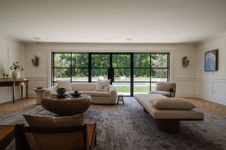 Cream colored sofas used in a living room