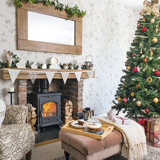 living room with fire place and charismas tree