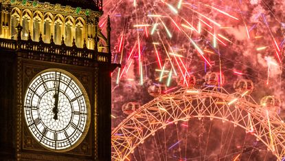 Fireworks light up the London skyline over Big Ben and the London Eye just after midnight on 1 January 2023 