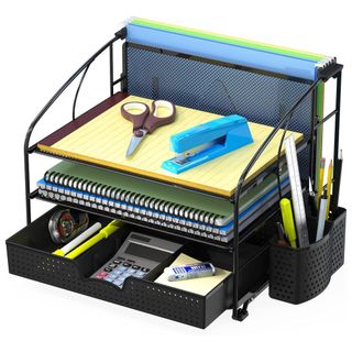 A black mesh desk organizer with papers, pens, scissors, stapler, calculator and file dividers