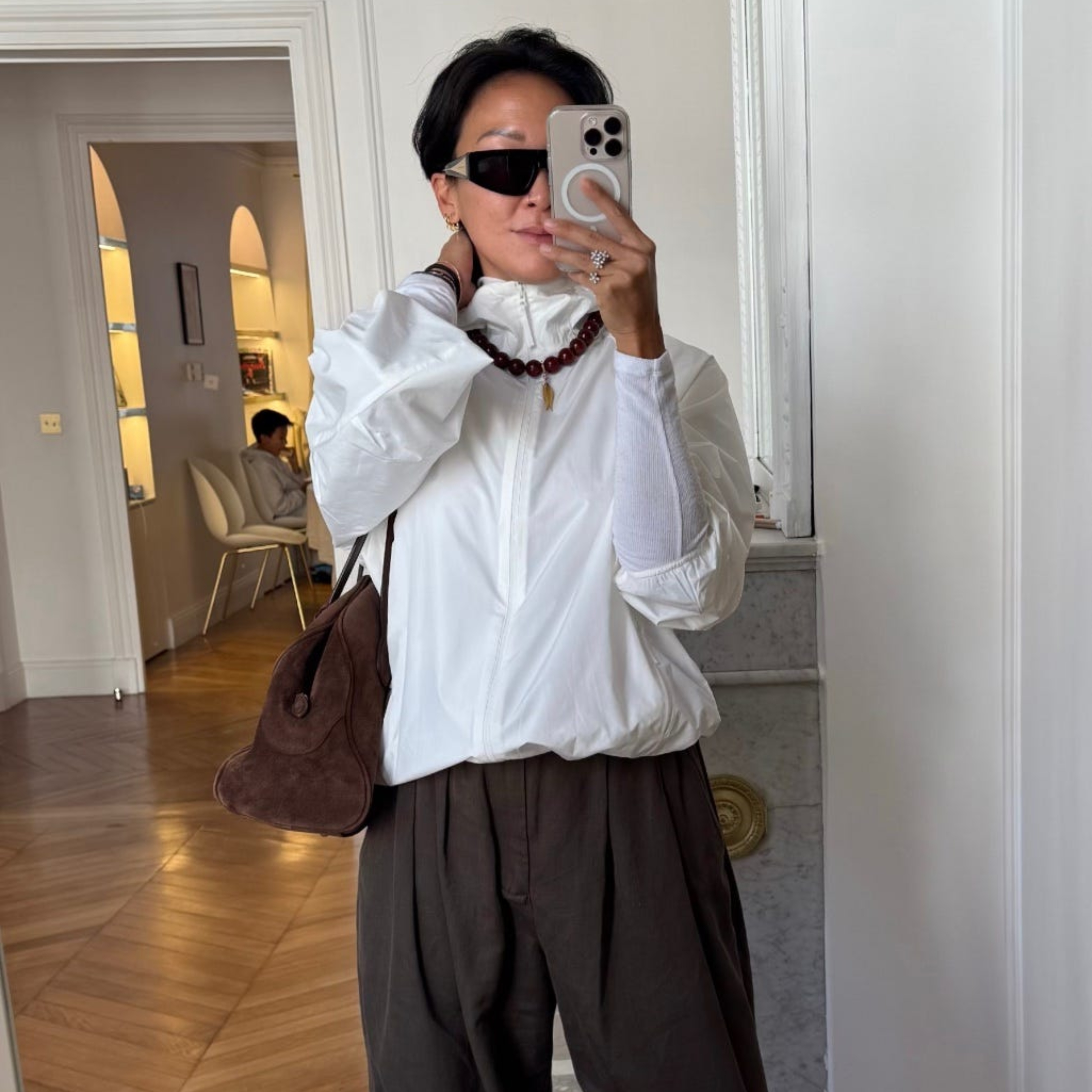 Irene Kim Fritz wearing a windbreaker and pants 