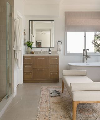 Neutral bathroom with wooden cabinet and gray blind