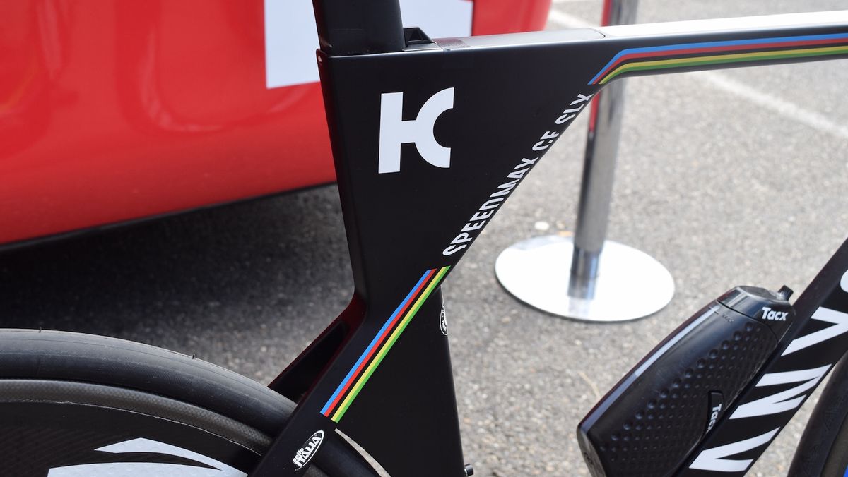 The bike is a predominantly black design with the world champion rainbow stripes as highlights