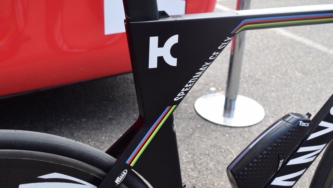 The bike is a predominantly black design with the world champion rainbow stripes as highlights