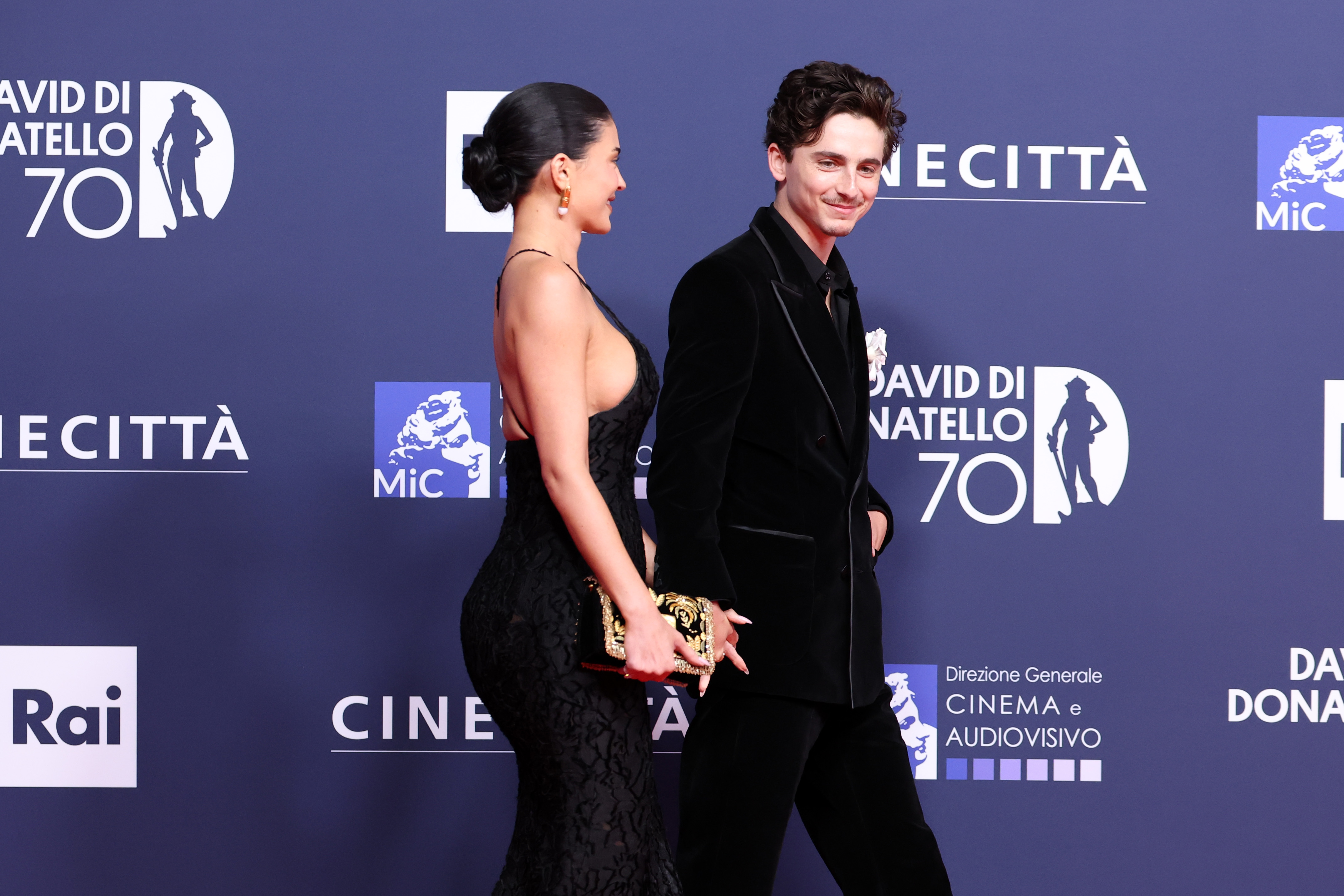 Timothee Chalamet and Kylie Jenner holding hands on a red carpet