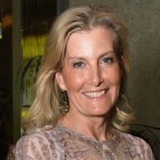 Duchess Sophie wearing a sheer blue paisley dress and smiling