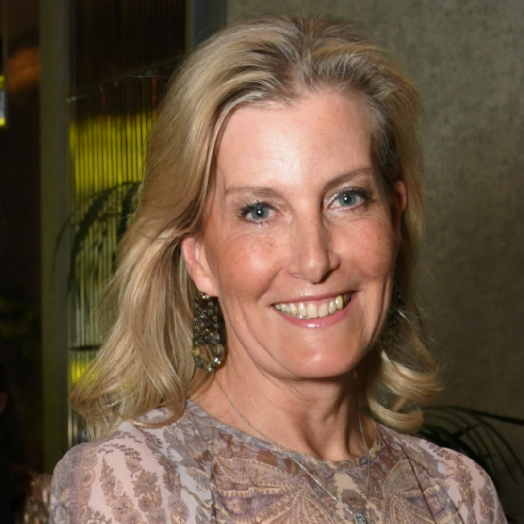 Duchess Sophie wearing a sheer blue paisley dress and smiling