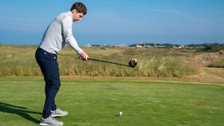 A steep golf swing with a driver