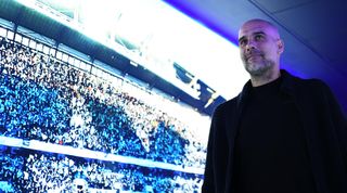 Manchester City manager Pep Guardiola arrives at the stadium prior to the Premier League match between Manchester City and Chelsea at the Etihad Stadium on May 21, 2023 in Manchester, England.