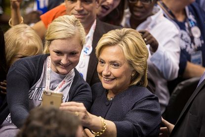 Hillary wants to win your vote with a selfie. 