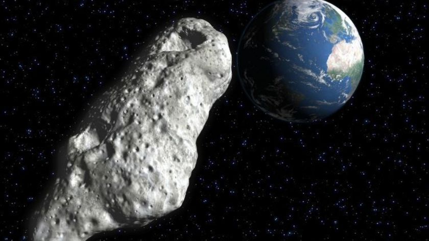 A gray rocky asteroid heads back toward Earth in the darkness of space