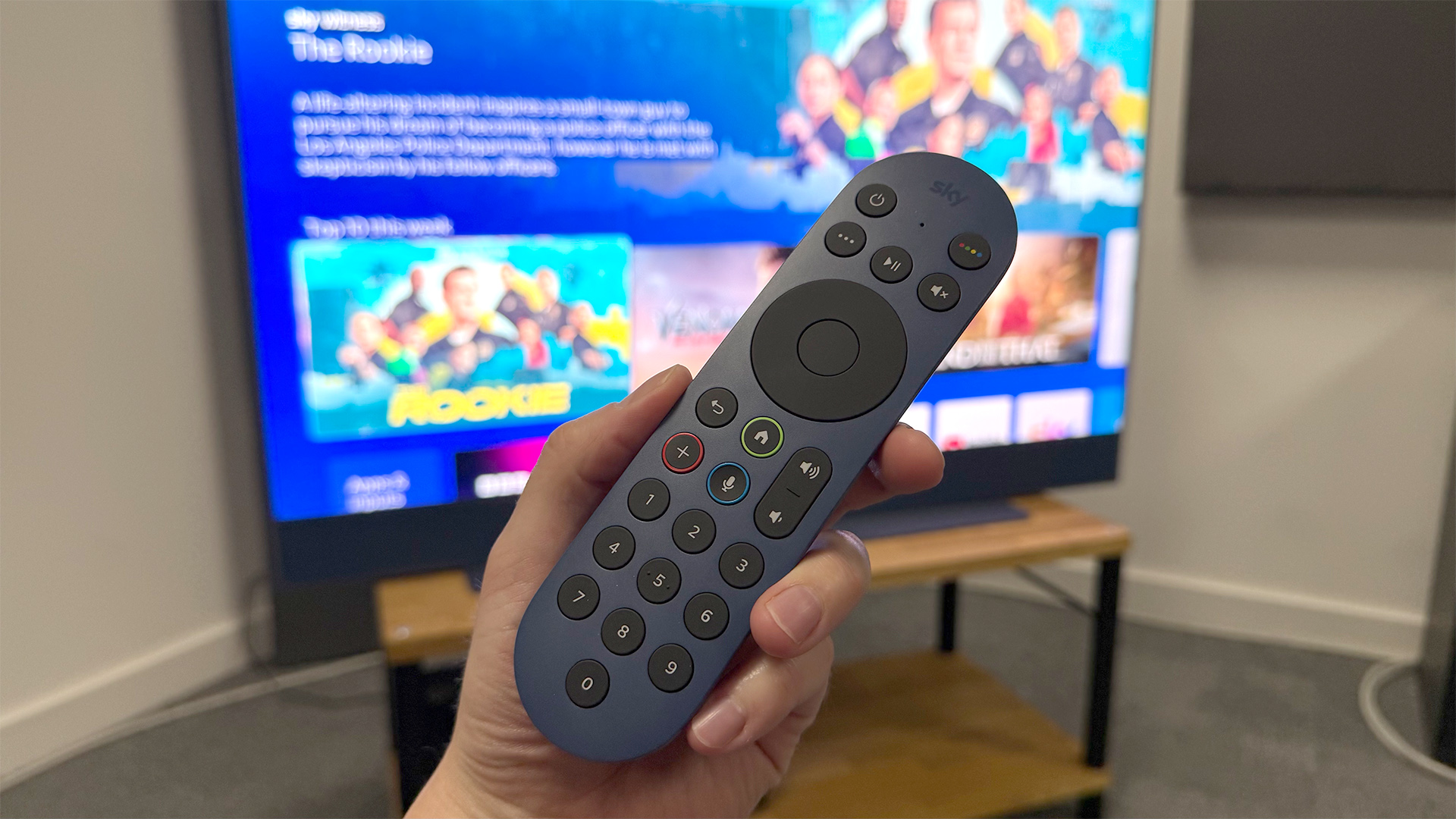 Sky Glass Gen 2 TV, soundbar and streaming service with TV remote held in hand