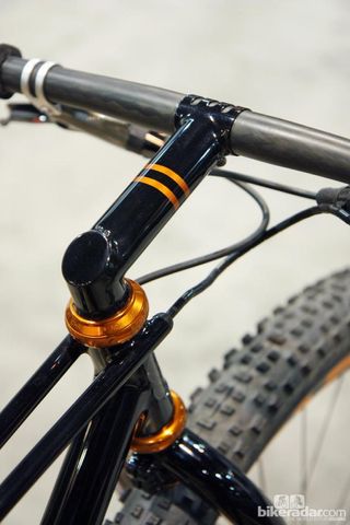 English's trademark one-piece stem and steerer inserts into the head tube