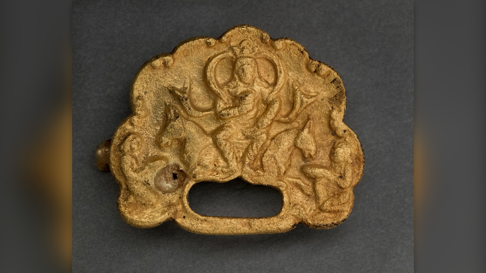 1,500-year-old gold buckles depicting ruler 'majestically sitting